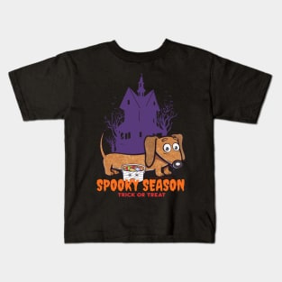 Funny and cute haunted house Doxie Dachshund during spooky season with scary house and trees Kids T-Shirt